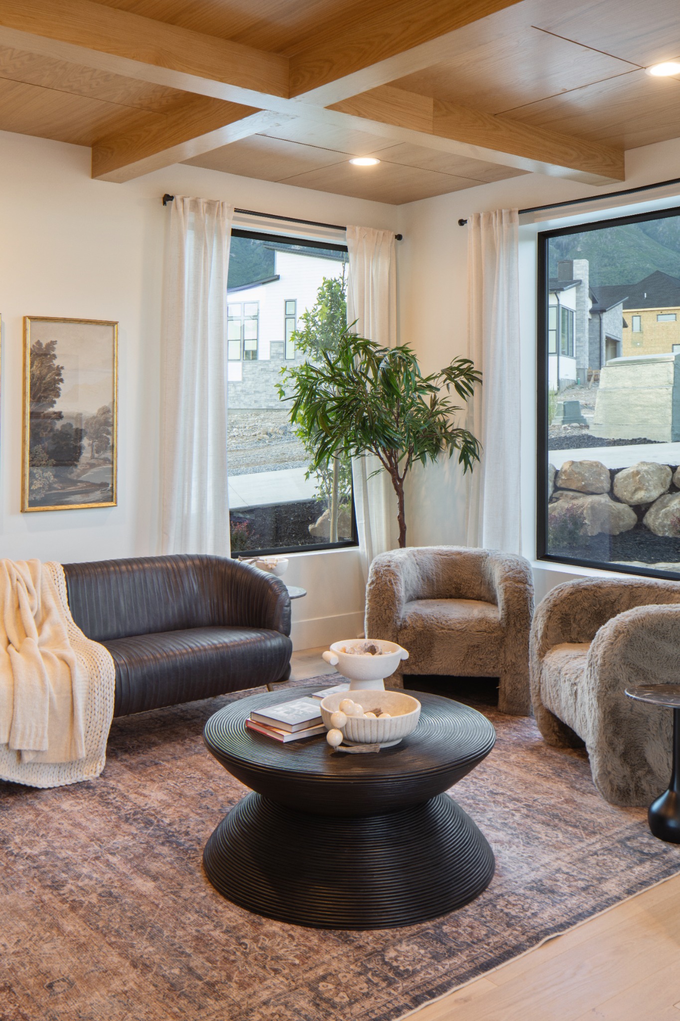 Warmly layered living room interior by DZYN Fusion Studio
